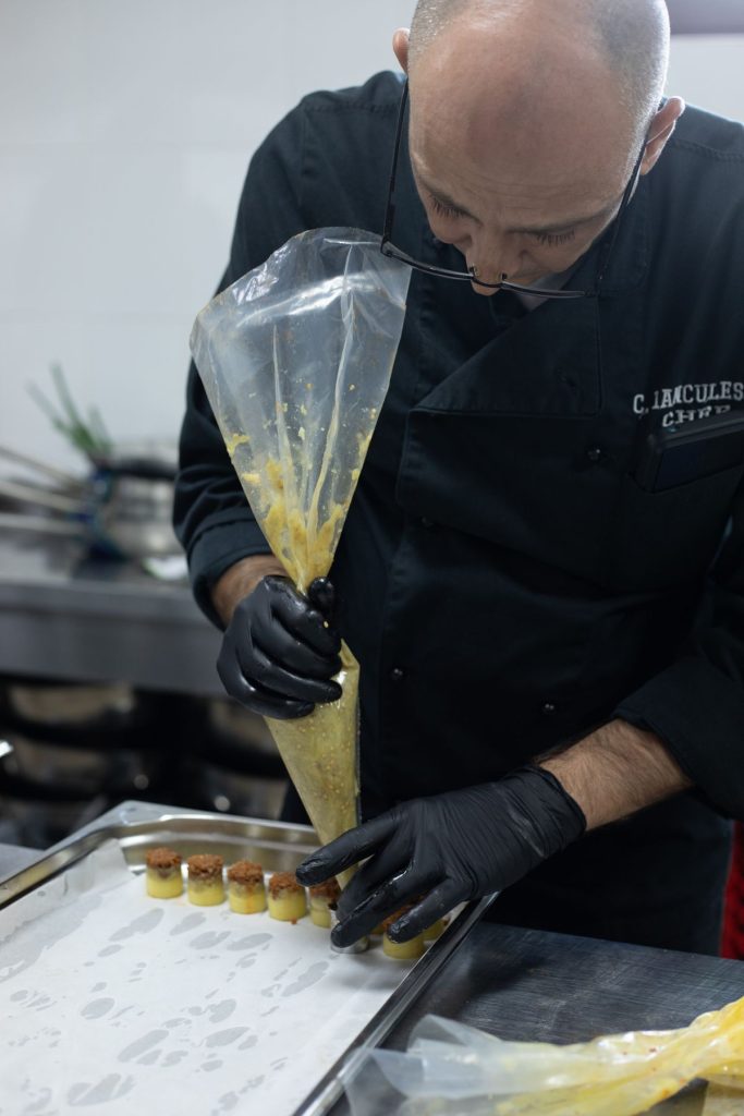 Cernica Events chef preparing dishes in the in-house kitchen