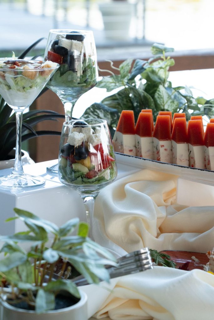 Salads served in glasses at a catering buffet
